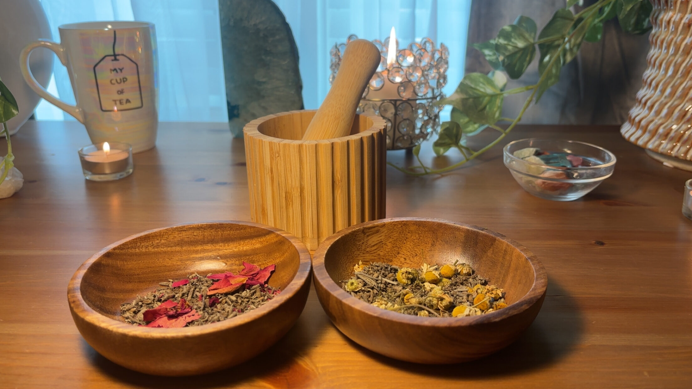 Bowls of dried botanicals beside a mortar and pestle